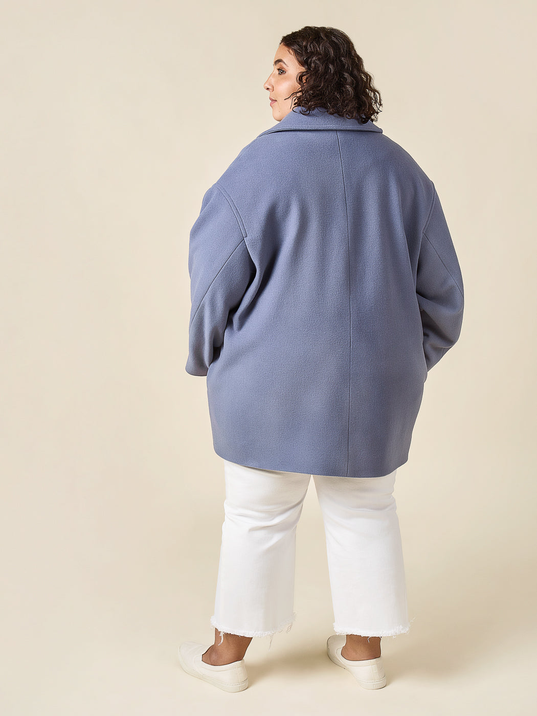 Back view of a blue short coat sewn from the Closet Core Phoebe Coat PDF sewing pattern
