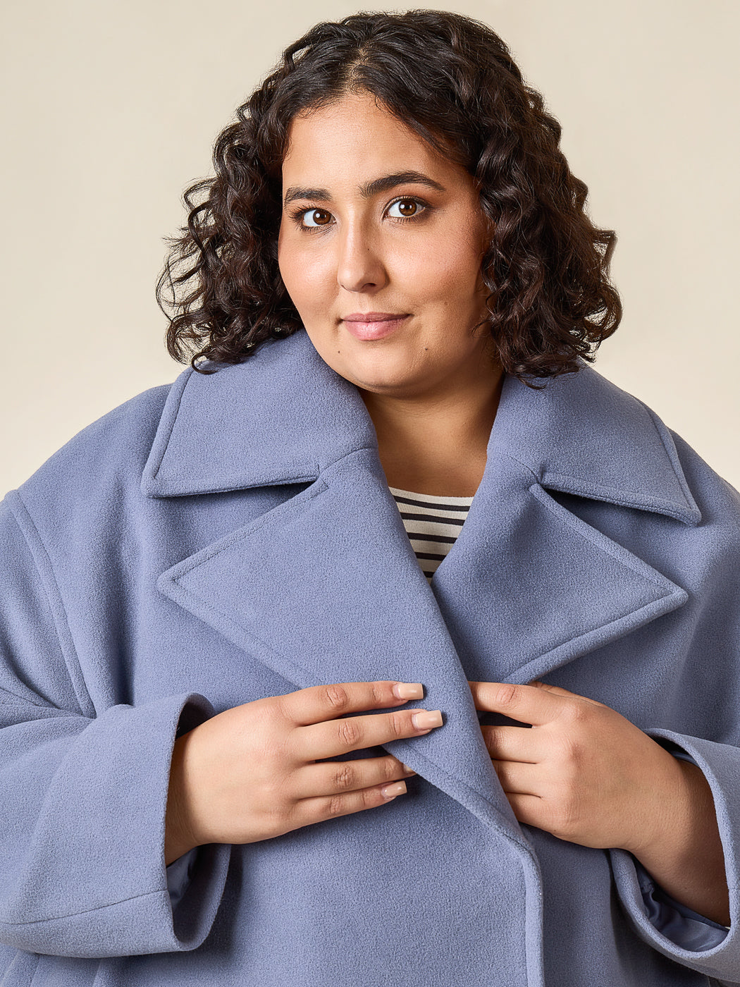 Close-up of a blue coat collar and buttons, Closet Core Phoebe Coat PDF sewing pattern
