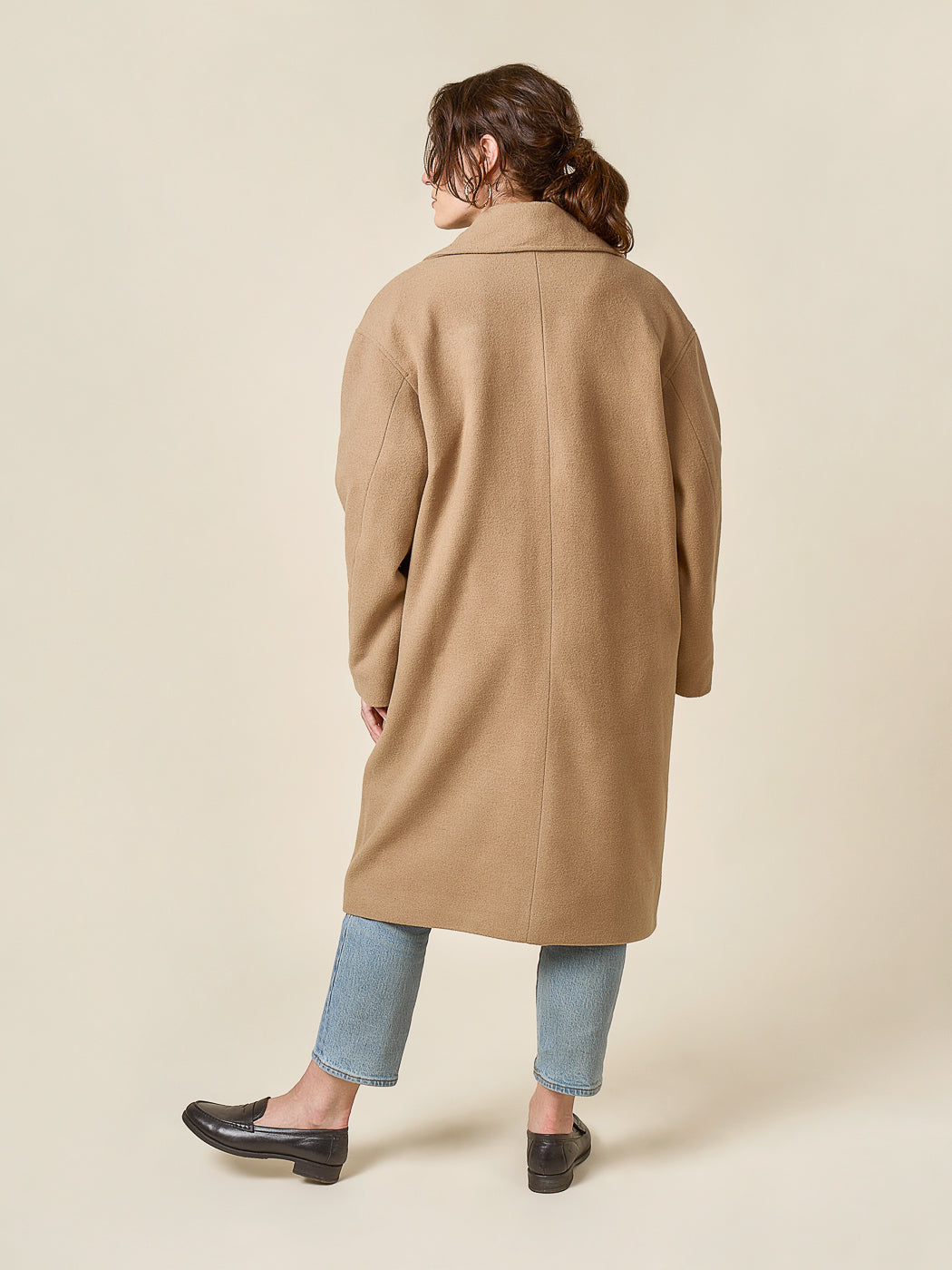 Side view of a camel coat with jeans, Closet Core Phoebe Coat PDF sewing pattern