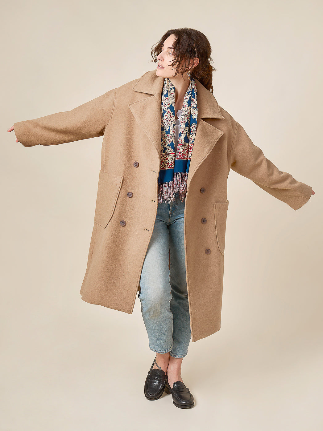 Camel coat held open mid twirl, Closet Core Phoebe Coat PDF sewing pattern