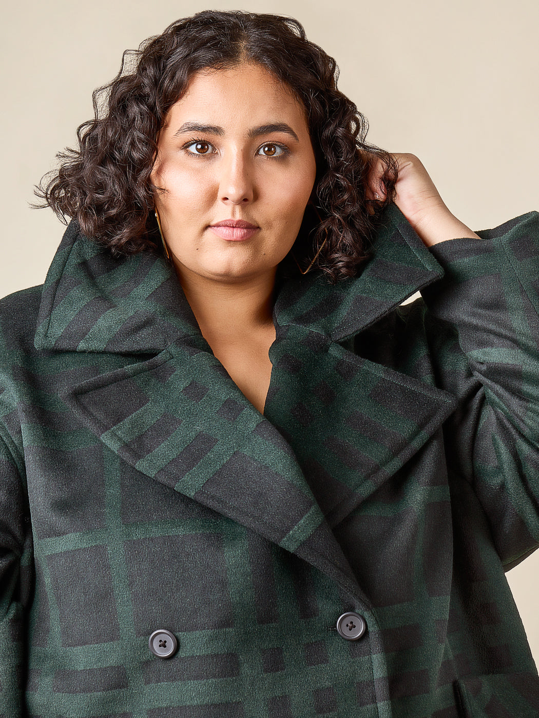 Green plaid coat held closed, close-up, Closet Core Phoebe Coat PDF sewing pattern