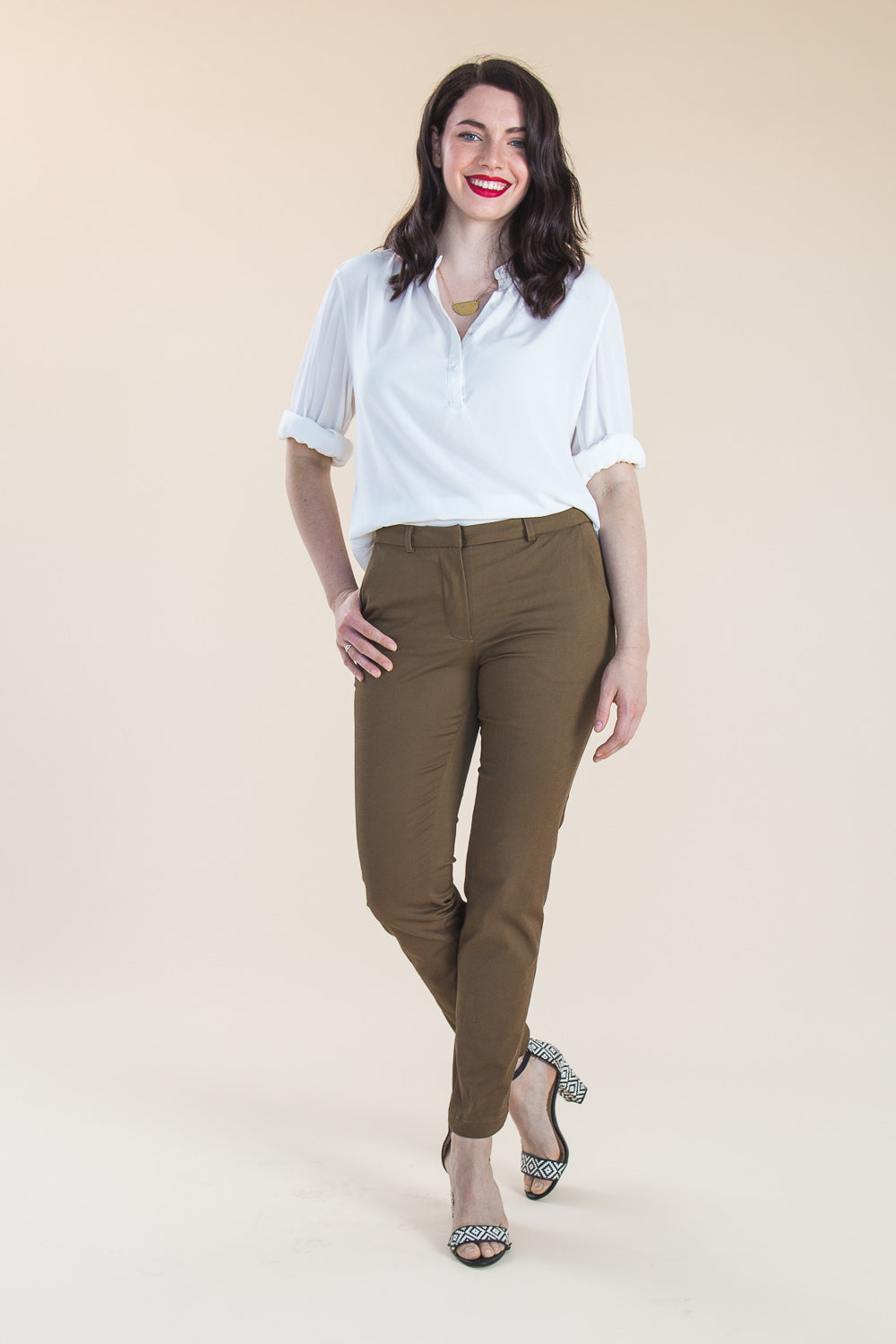 Model in khaki tapered trousers and white shirt sewn from the Closet Core Sasha Trousers PDF sewing pattern