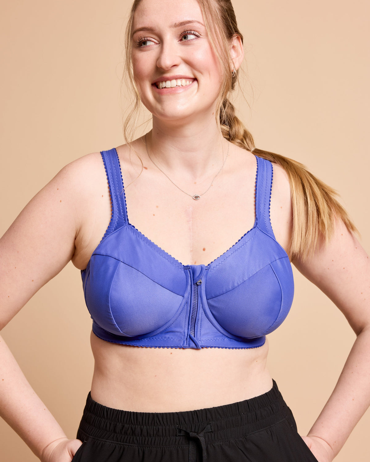 Cashmerette Somerville Sports Bra PDF sewing pattern, woman wearing a blue bra, three quarter view