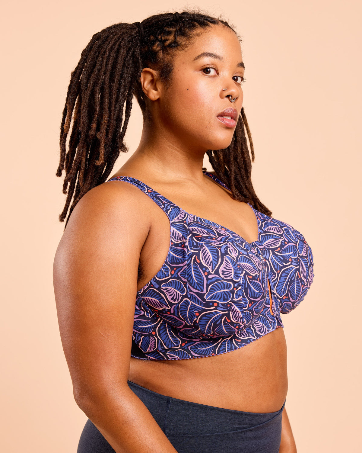 Cashmerette Somerville Sports Bra PDF sewing pattern, woman wearing a blue patterned top
