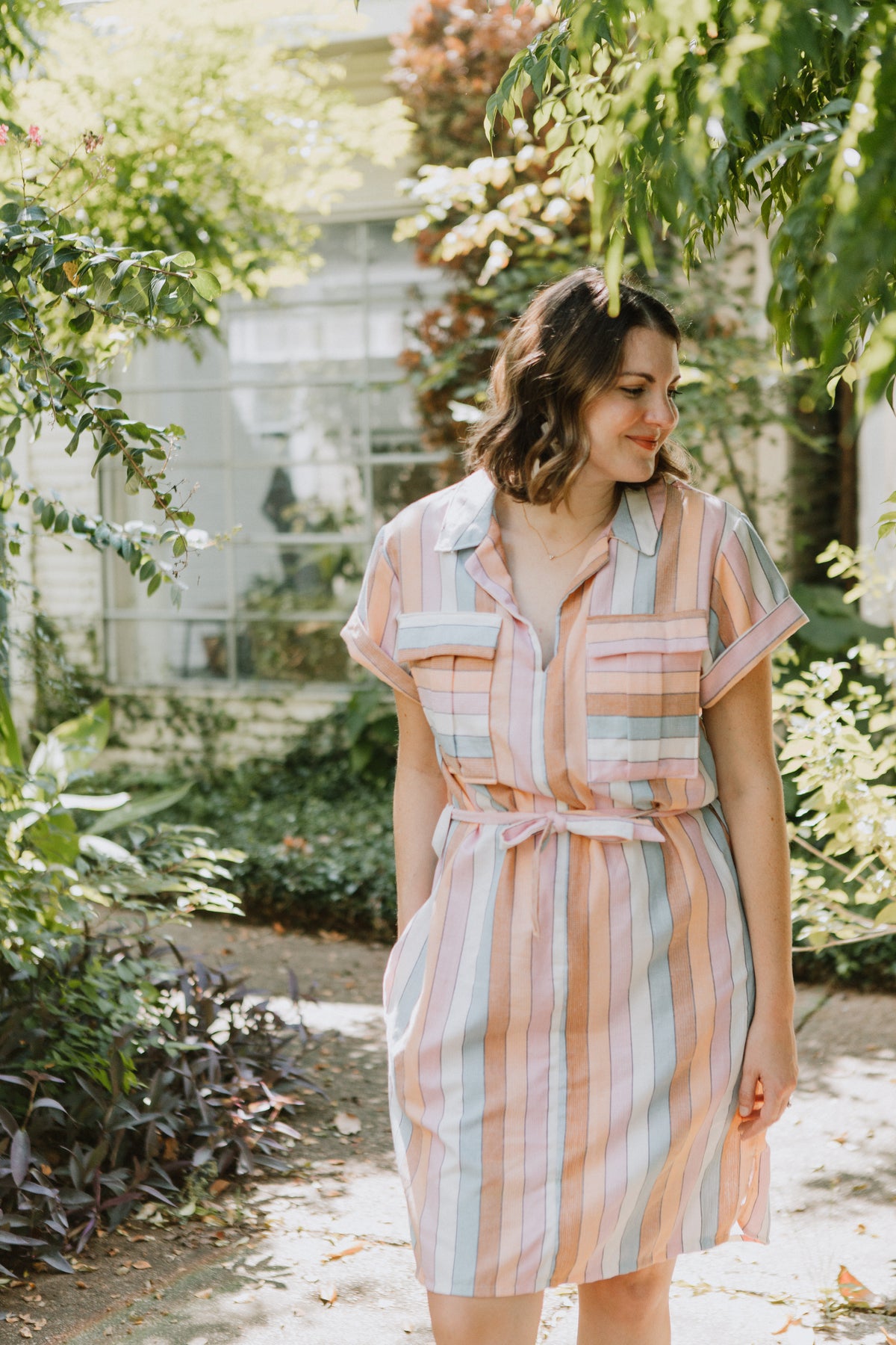 Sew to Grow Sydni Shirtdress PDF sewing pattern, model in a green floral shirtdress