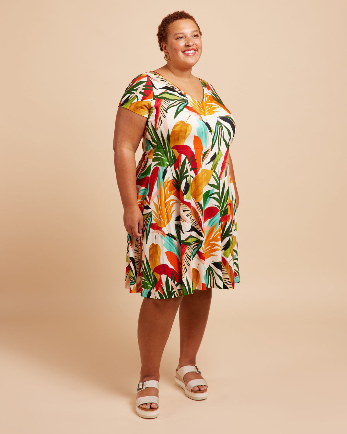 Cashmerette Turner Dress PDF sewing pattern, woman wearing a colorful tropical print dress