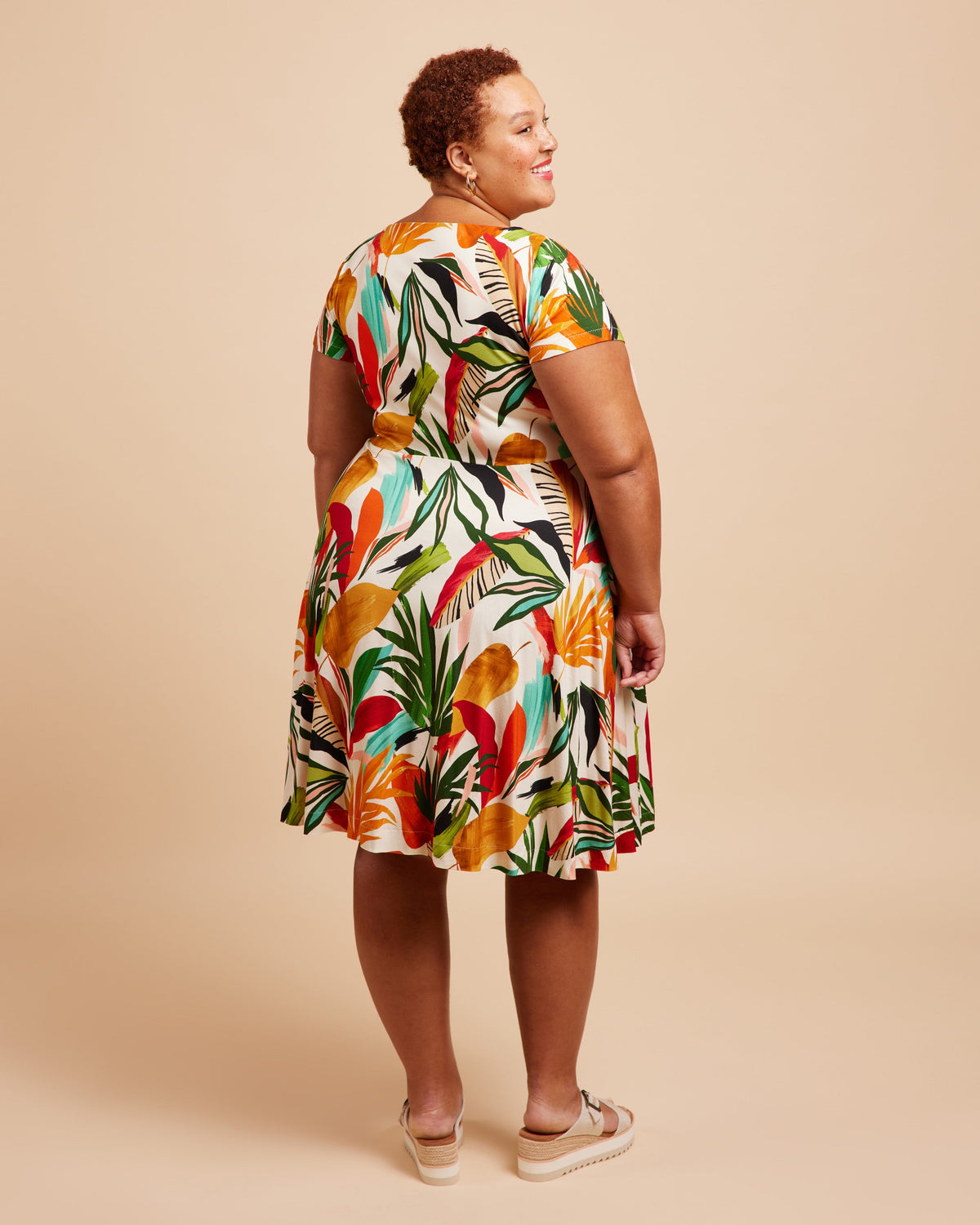 Cashmerette Turner Dress PDF sewing pattern, woman in a bright floral print knit dress