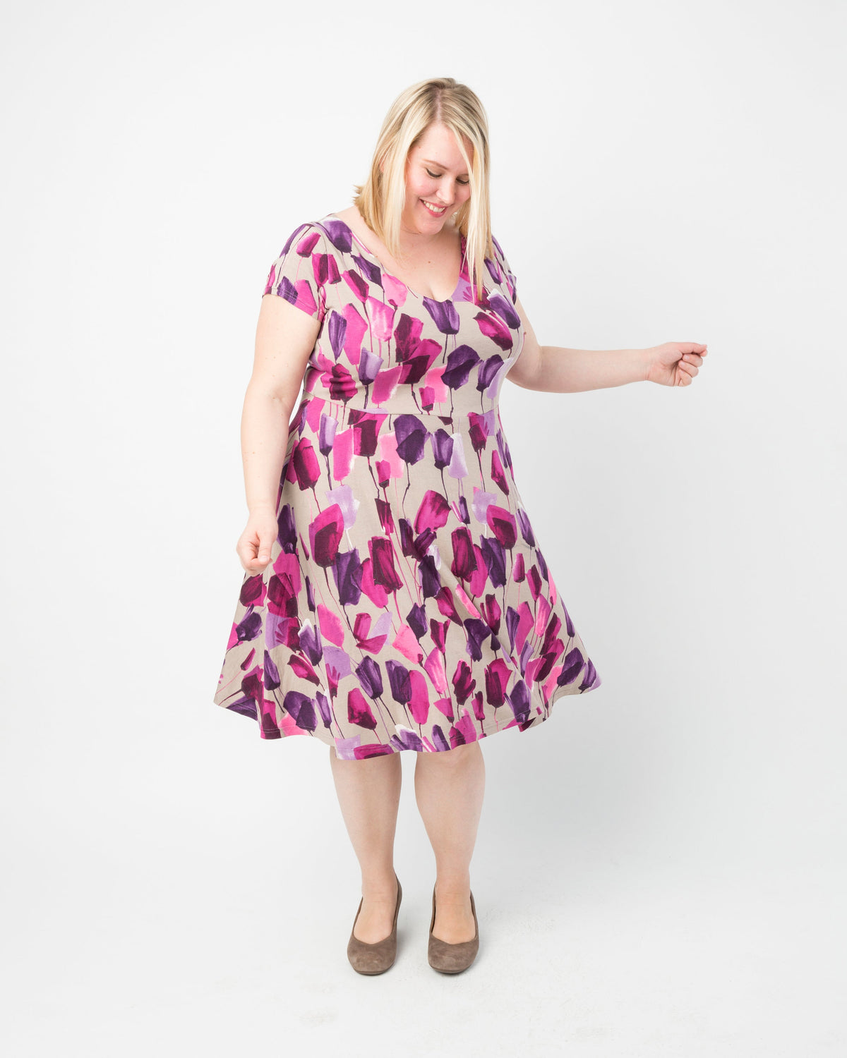 Cashmerette Turner Dress PDF sewing pattern, woman wearing a floral dress, pink floral front view