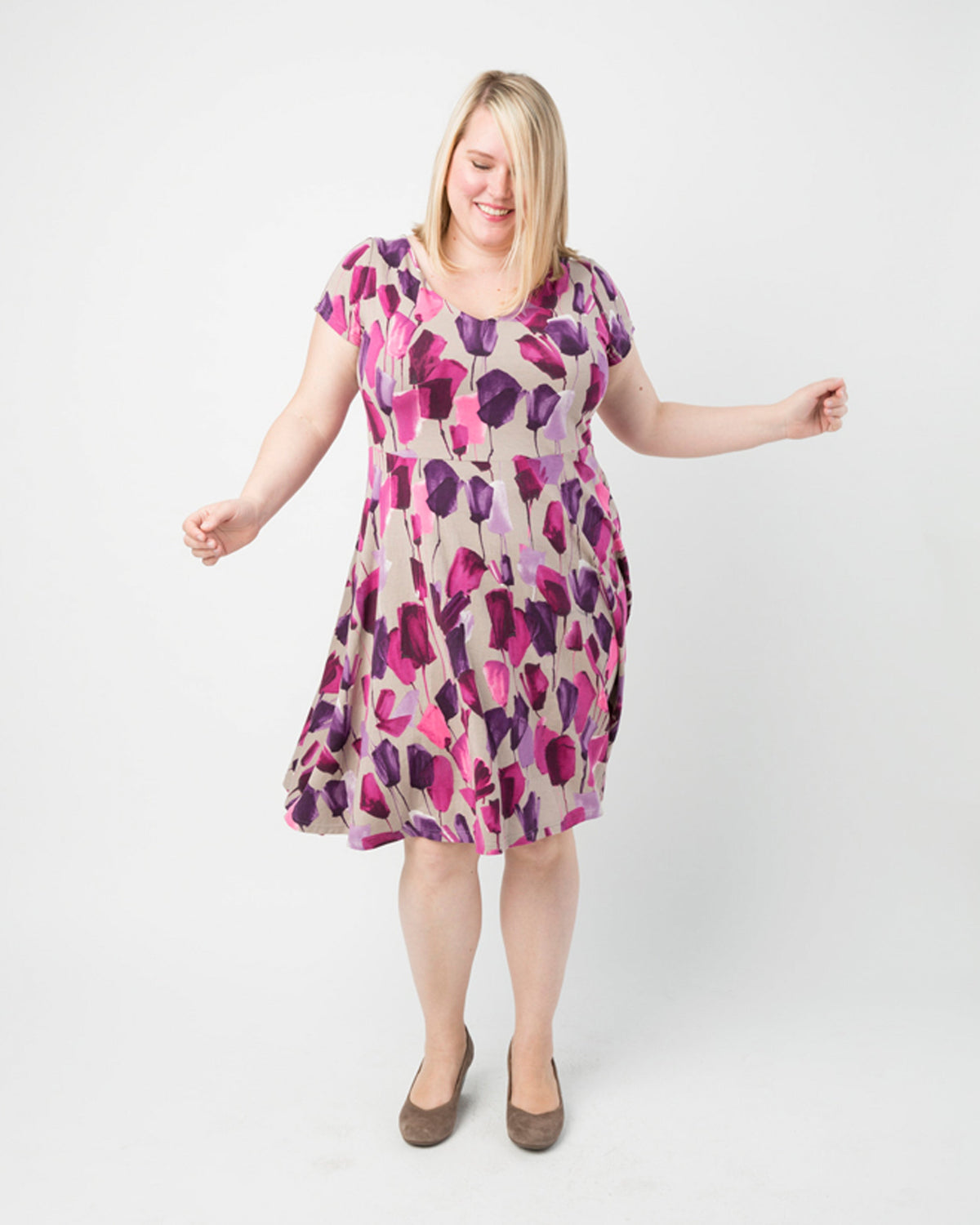 Cashmerette Turner Dress PDF sewing pattern, woman wearing a floral dress, pink floral three quarter view