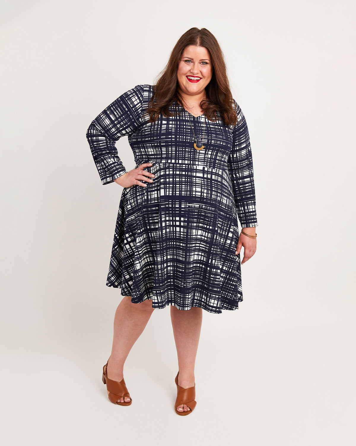 Cashmerette Turner Dress PDF sewing pattern, woman wearing a blue plaid dress, navy print front view