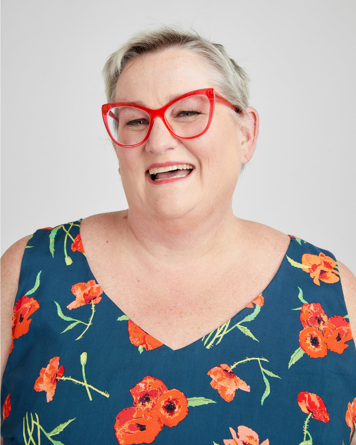 Cashmerette Upton Dress and Skirt Plus expansion pack PDF sewing pattern, person wearing a blue floral dress with red glasses