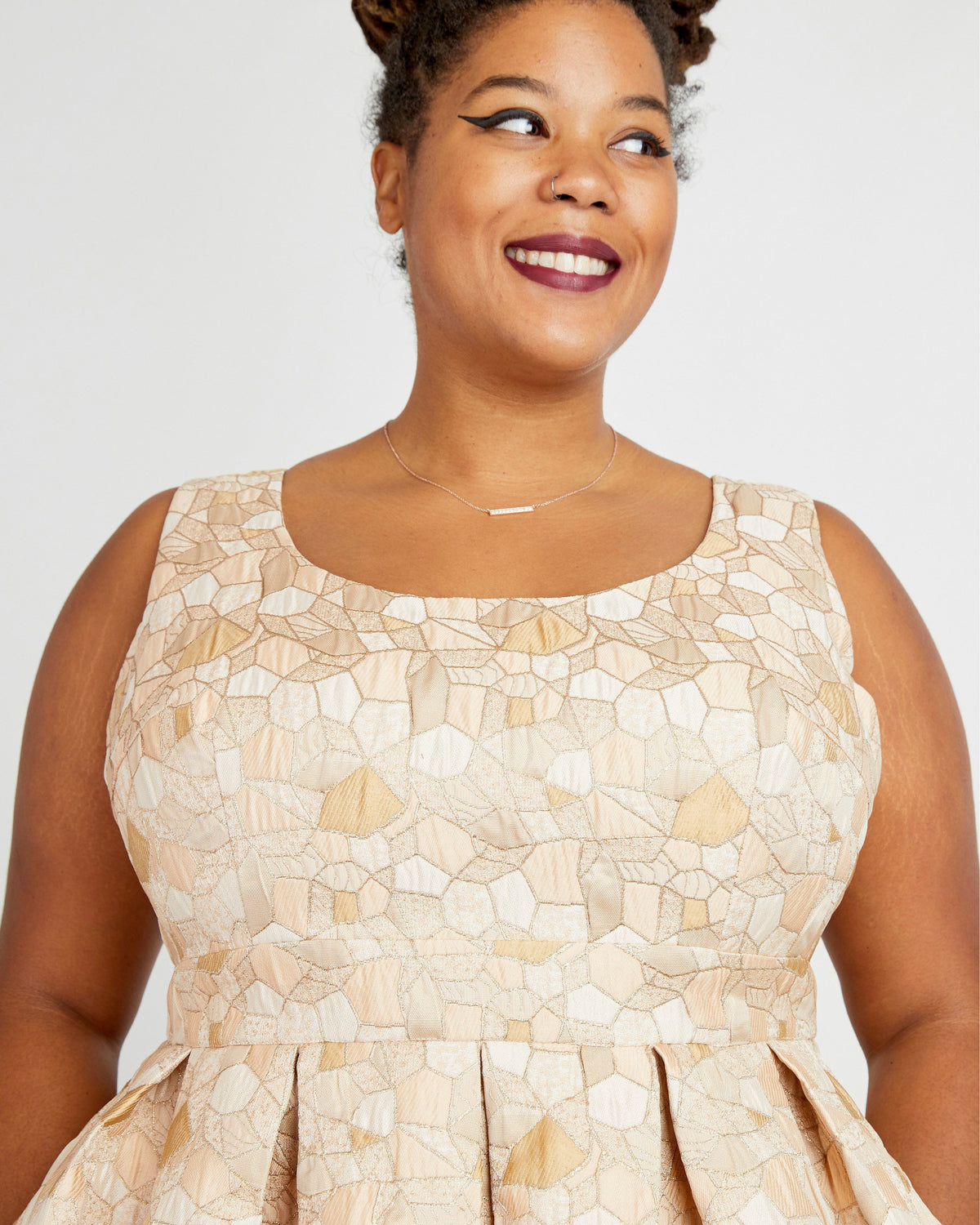 Cashmerette Upton Dress and Skirt Plus expansion pack PDF sewing pattern, woman wearing a beige patterned dress, close-up of the bodice