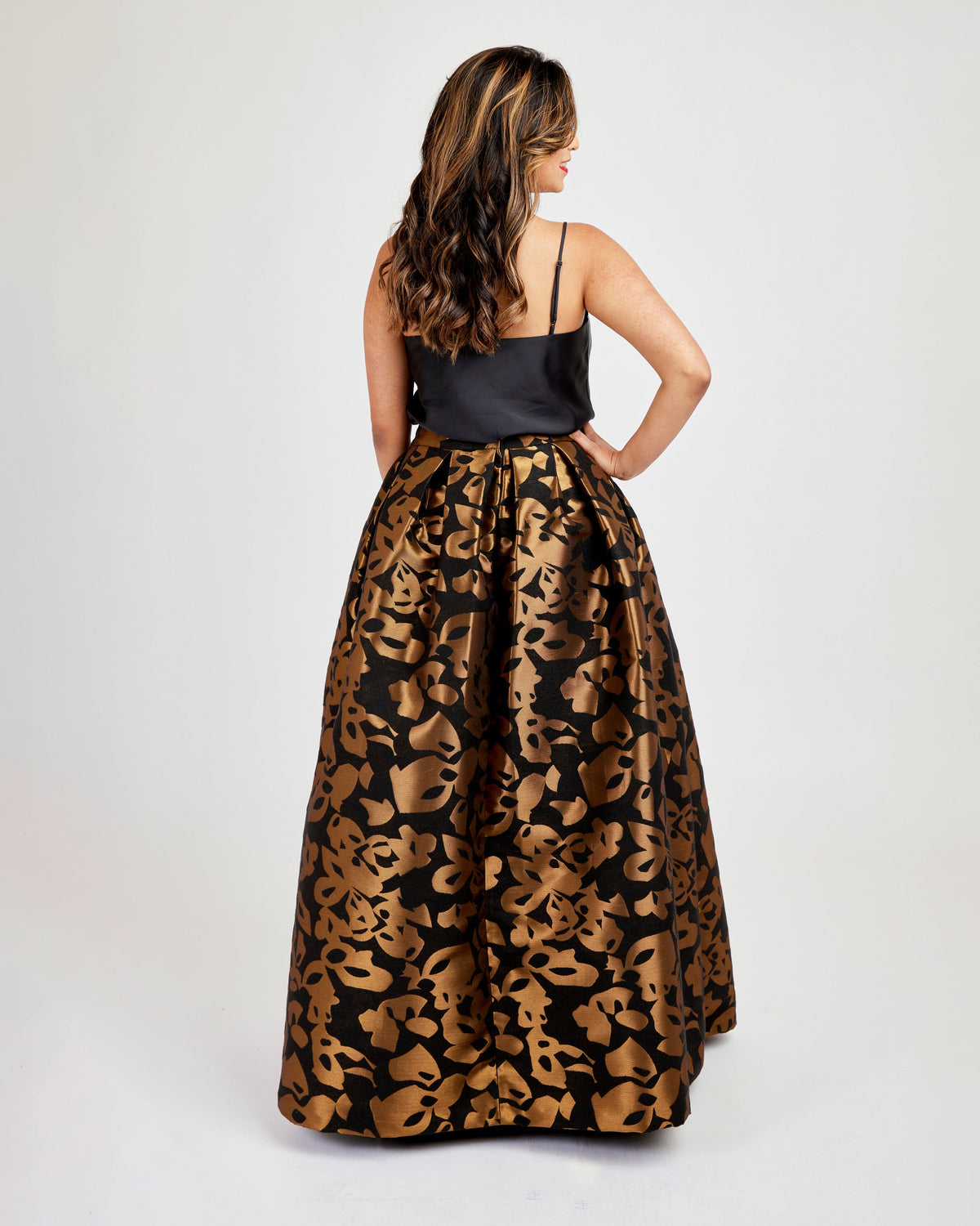 Cashmerette Upton Dress and Skirt Plus expansion pack PDF sewing pattern, woman wearing a black top and leopard print skirt, brown floral back