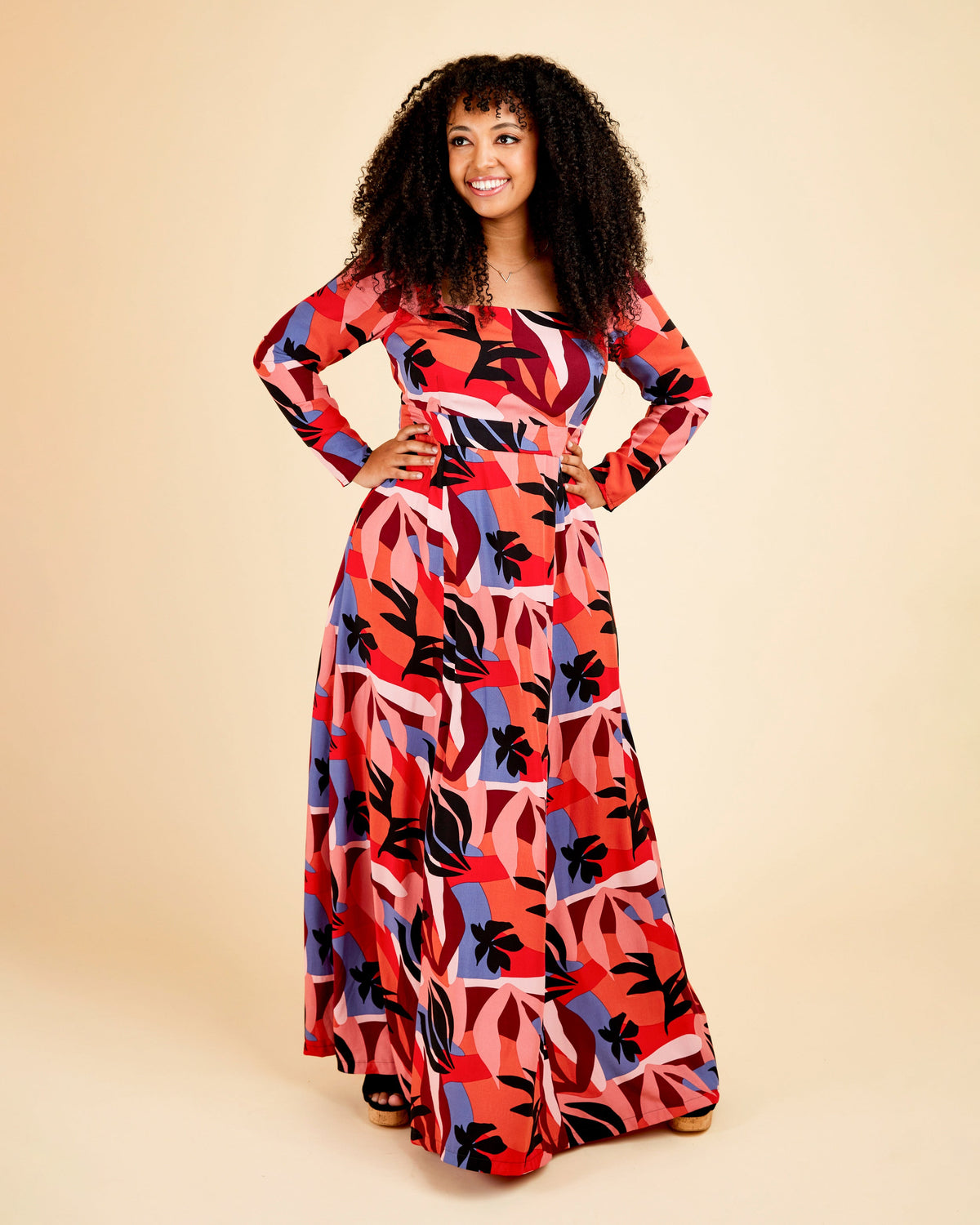 Cashmerette Upton Dress and Skirt Plus expansion pack PDF sewing pattern, woman wearing a colorful patterned dress, red floral maxi