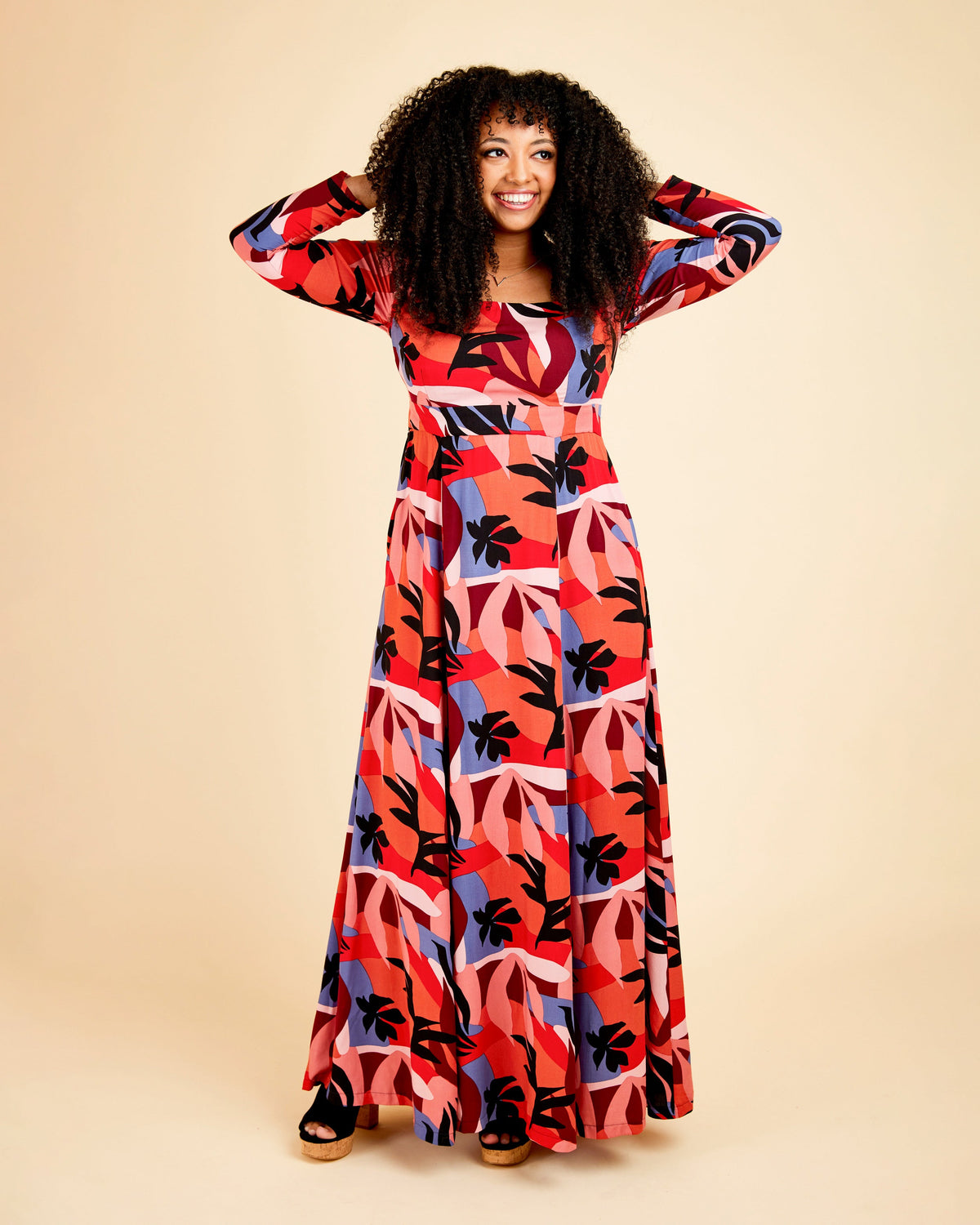 Cashmerette Upton Dress and Skirt Plus expansion pack PDF sewing pattern, woman wearing a colorful patterned dress, red floral maxi front