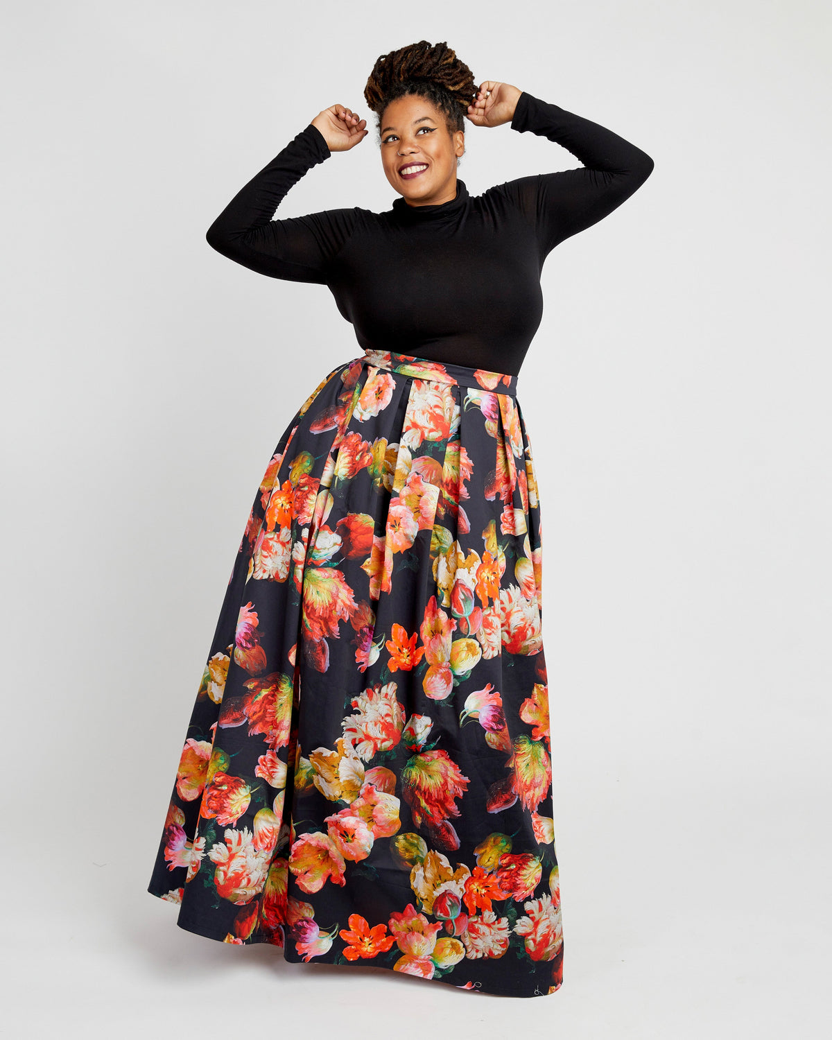 Cashmerette Upton Dress and Skirt Plus expansion pack PDF sewing pattern, woman wearing a black long-sleeve top and floral skirt