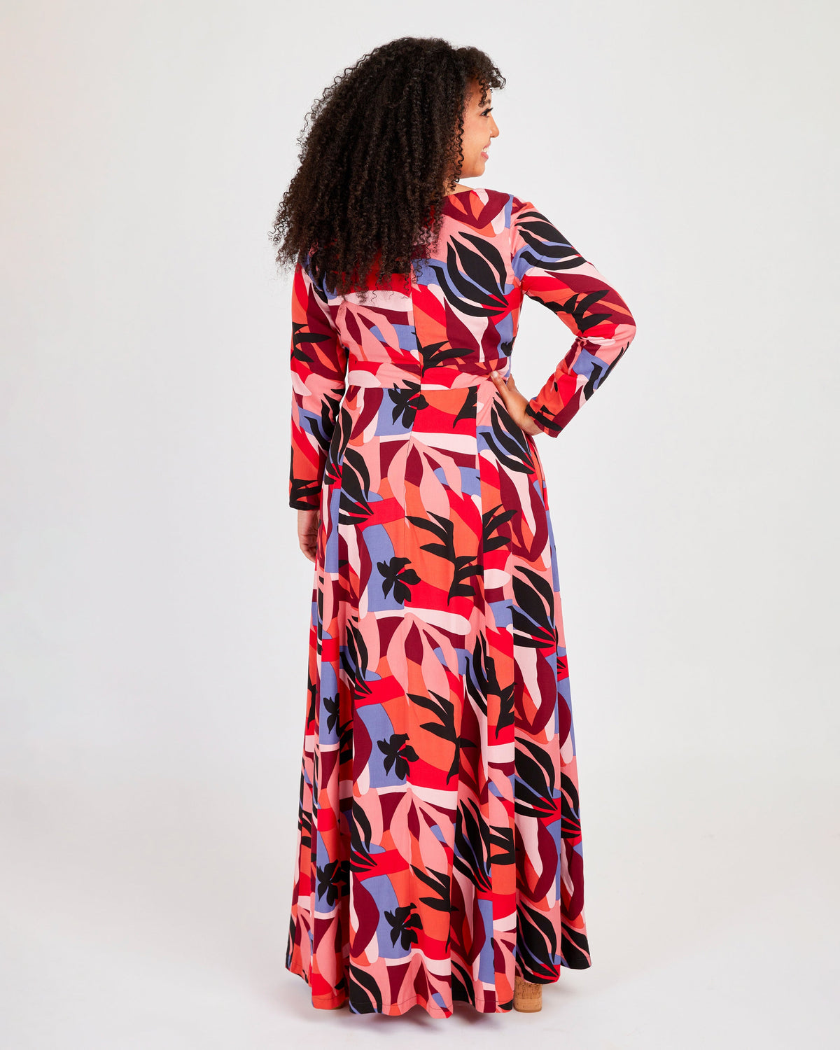 Cashmerette Upton Dress and Skirt Plus expansion pack PDF sewing pattern, woman wearing a colorful patterned dress, red floral maxi back