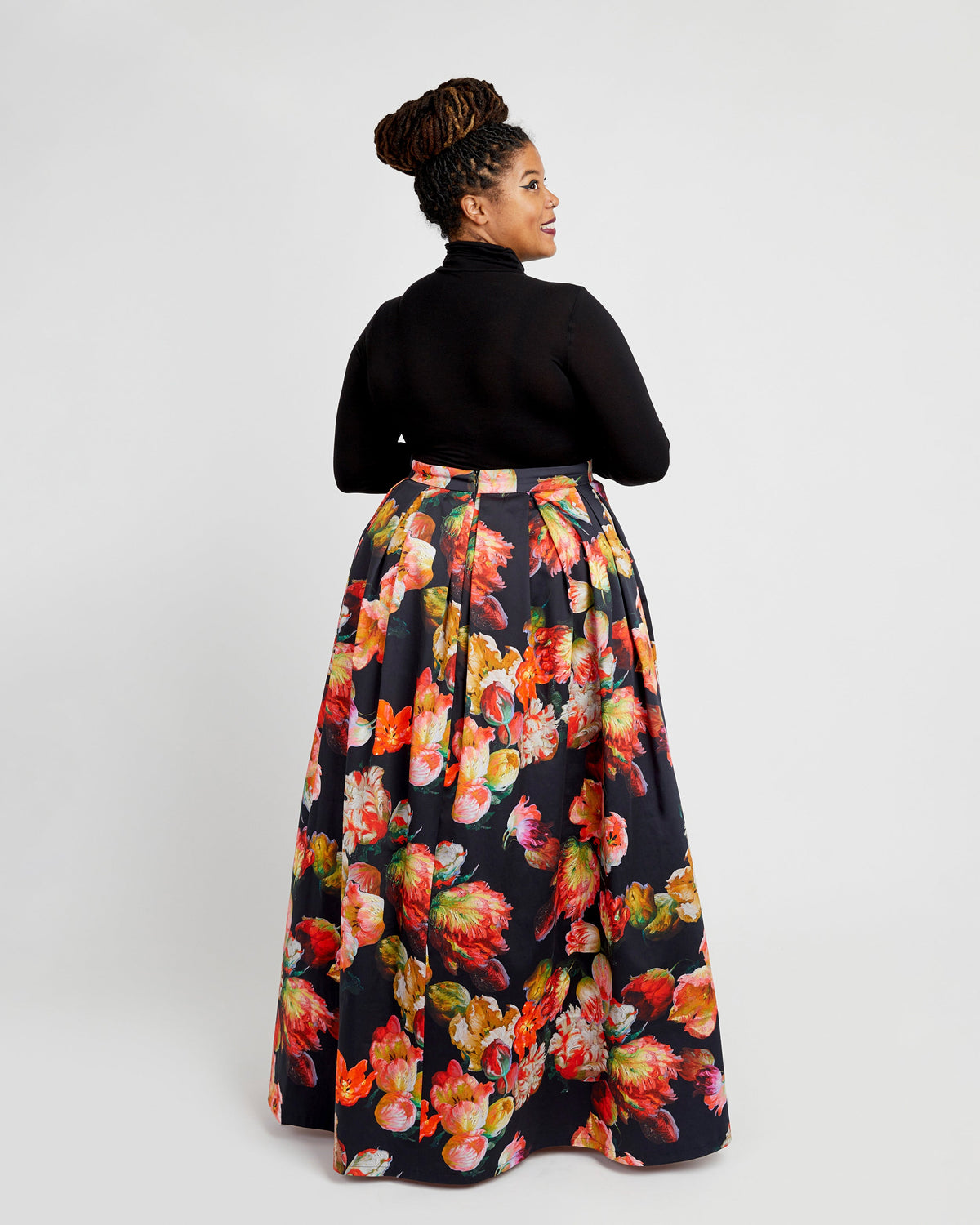 Cashmerette Upton Dress and Skirt Plus expansion pack PDF sewing pattern, woman wearing a black turtleneck and floral skirt
