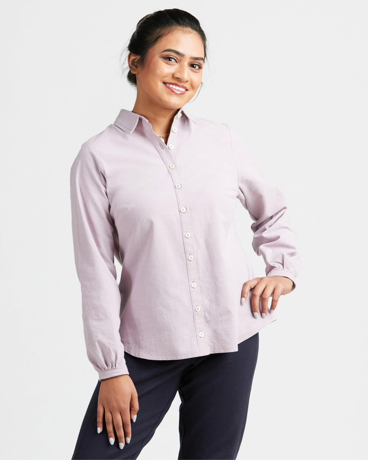 Cashmerette Vernon Shirt PDF sewing pattern, woman wearing a light purple button-up shirt and dark pants
