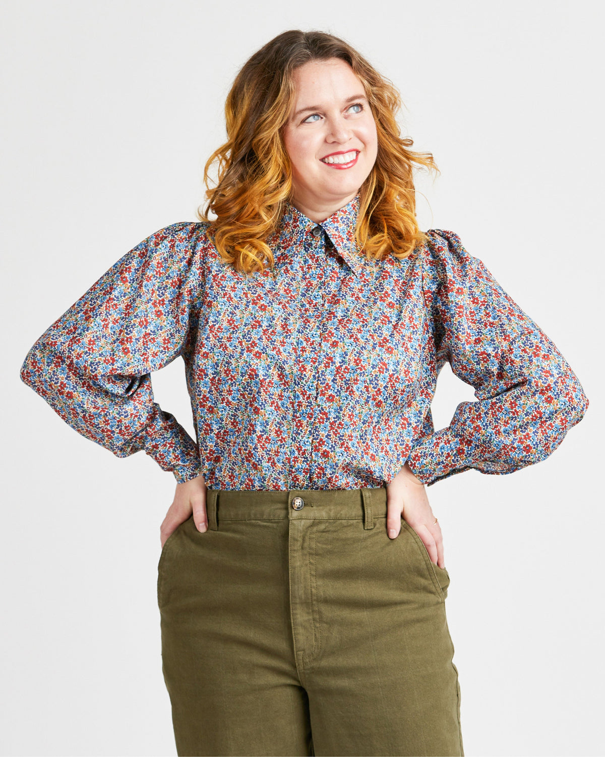 Cashmerette Vernon Shirt PDF sewing pattern, woman wearing a floral blouse and green pants, front view