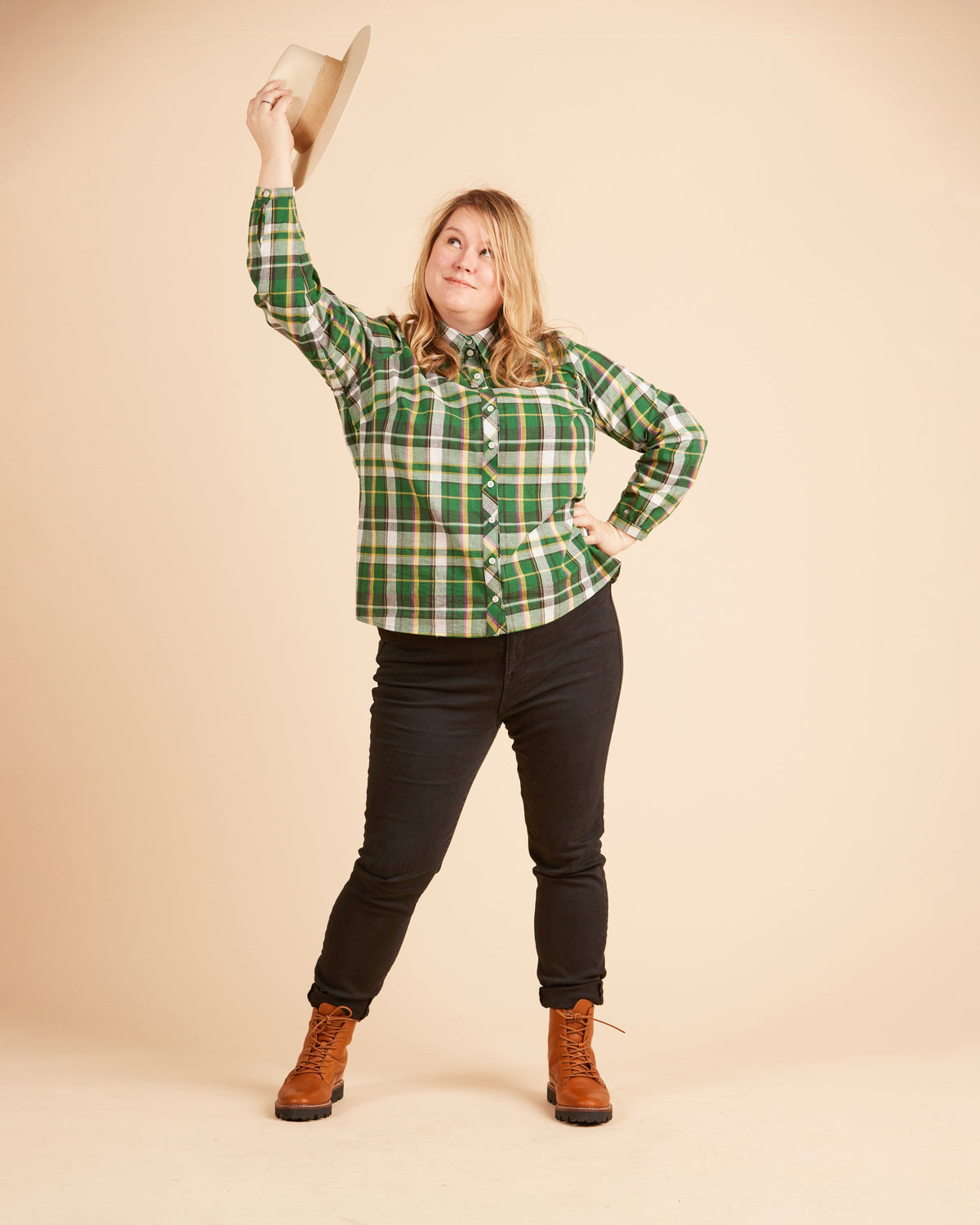 Cashmerette Vernon Shirt PDF sewing pattern, person wearing a green plaid shirt, black pants, and brown boots