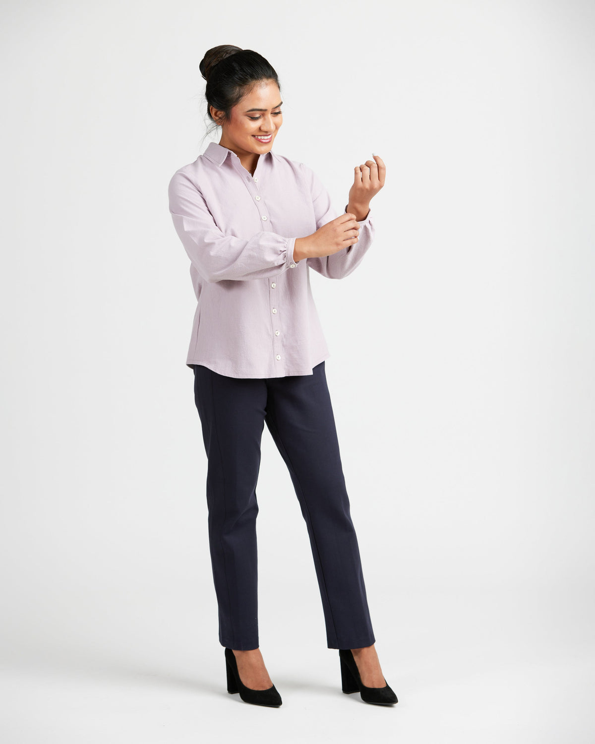 Cashmerette Vernon Shirt PDF sewing pattern, woman wearing a light pink blouse and dark pants
