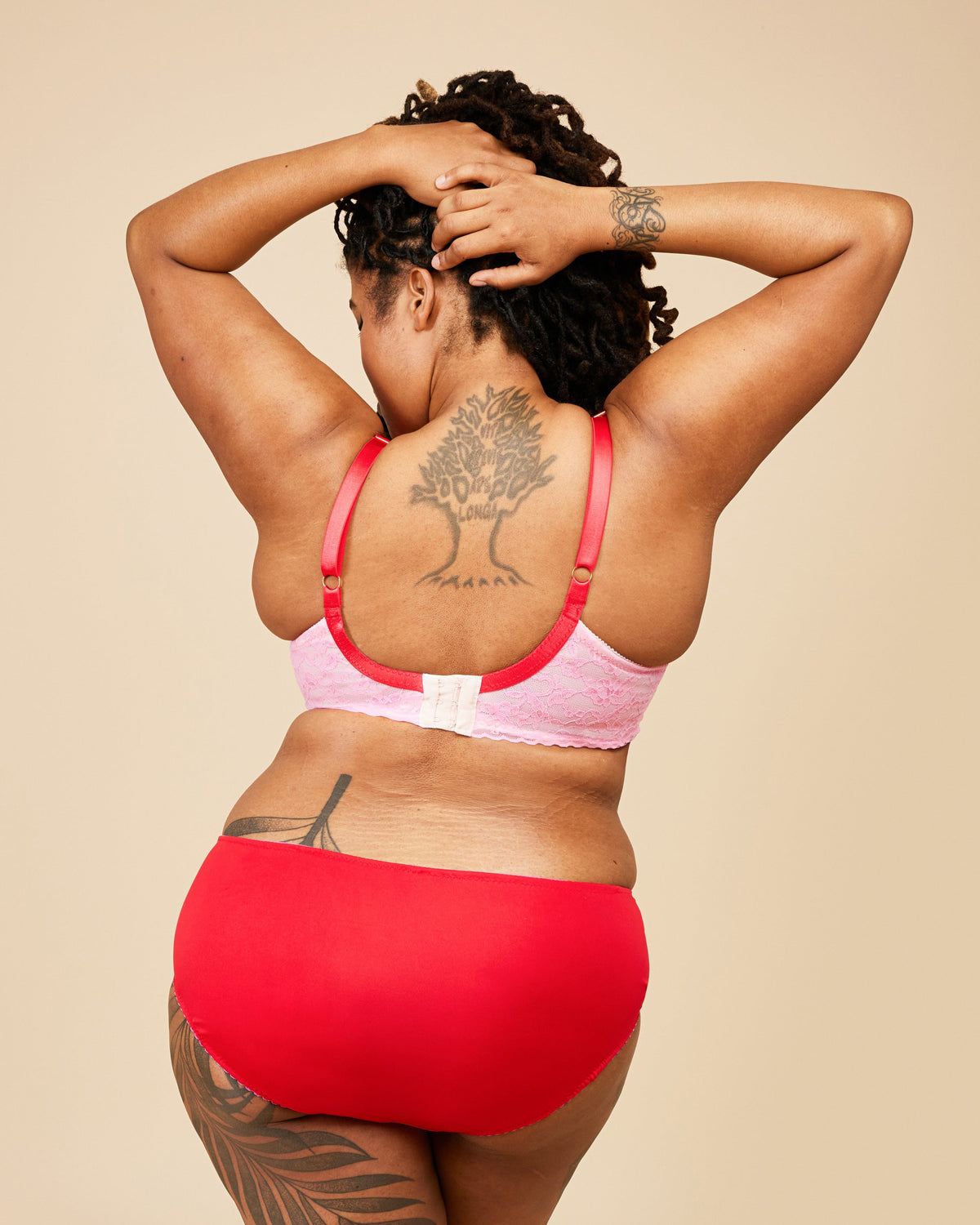Cashmerette Willowdale Bra PDF sewing pattern, person wearing a pink bikini top and red bottoms