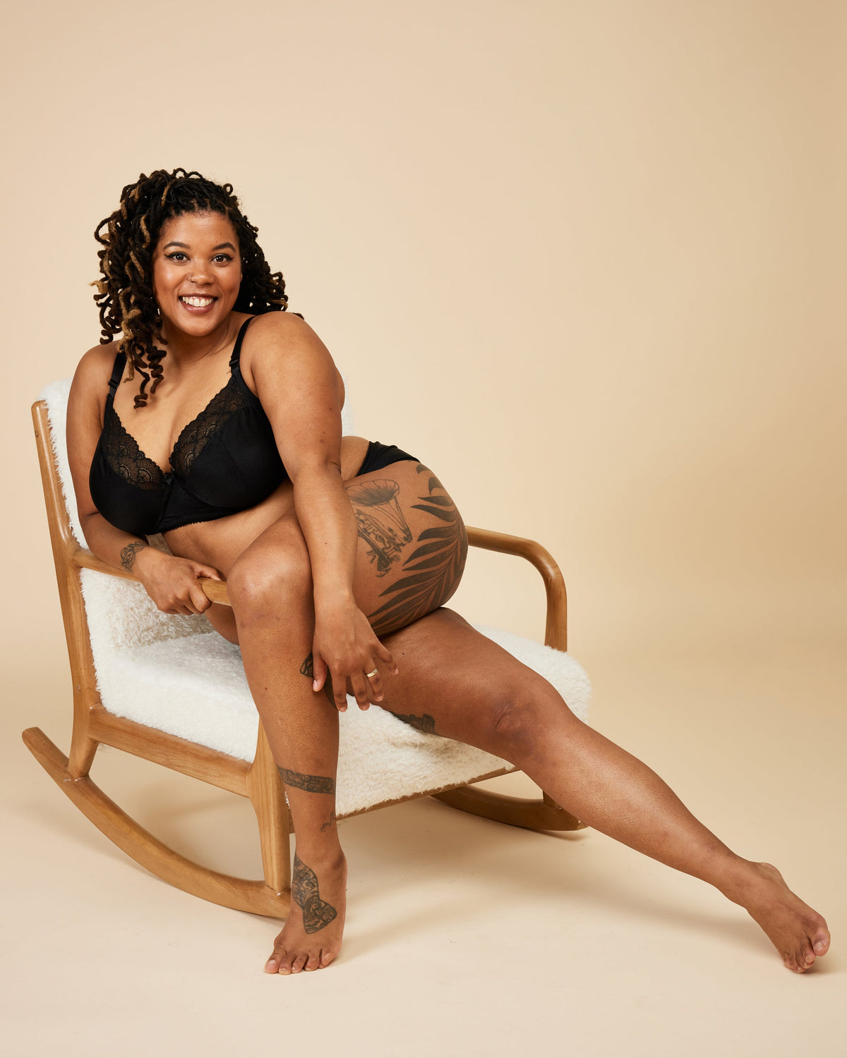 Cashmerette Willowdale Bra PDF sewing pattern, woman sitting on a rocking chair wearing black lingerie
